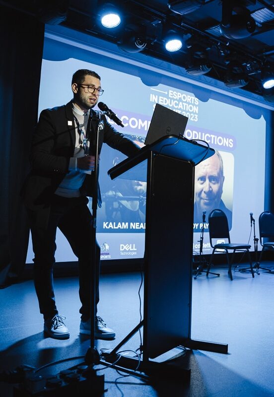 Image depicts Kalam Neale on stage at the Esports in Education Summit 2023