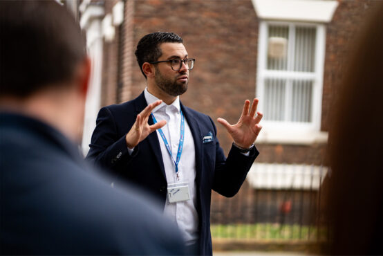 Head of Education Kalam Neale discussing the NEPC with students from Sunderland College