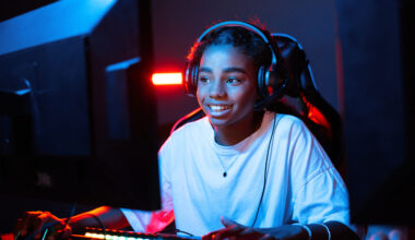 Teen playing in video game club