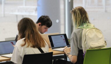 College of Esports Image of Students Studying on Laptops
